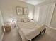 Light-filled bedroom featuring a cozy bed and closet, offering a peaceful retreat within the home at 5667 Sw 92Nd Pl, Ocala, FL 34476