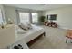 Bedroom featuring plenty of natural light, neutral-toned walls and light wood floors at 5667 Sw 92Nd Pl, Ocala, FL 34476