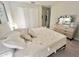 Comfortable bedroom with a dresser, and a closet, blending functionality with a calming aesthetic at 5667 Sw 92Nd Pl, Ocala, FL 34476