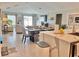 Bright and open dining area featuring modern decor and an adjacent view of the living room and the outdoors at 5667 Sw 92Nd Pl, Ocala, FL 34476