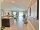 Hallway with a partial view of the kitchen and living room at 5667 Sw 92Nd Pl, Ocala, FL 34476