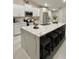 Modern kitchen with white cabinets, stainless steel appliances, a large island, and bar stool seating at 5667 Sw 92Nd Pl, Ocala, FL 34476