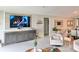 Comfortable living room featuring built in entertainment center and an open-concept layout leading to other areas at 5667 Sw 92Nd Pl, Ocala, FL 34476