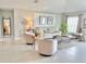 Bright living room with natural light showcasing comfortable seating and stylish decor elements at 5667 Sw 92Nd Pl, Ocala, FL 34476