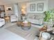 Inviting living room with neutral tones, comfortable seating, and stylish decor, creating a cozy atmosphere at 5667 Sw 92Nd Pl, Ocala, FL 34476
