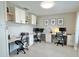 Spacious home office with multiple workstations and built-in cabinetry, offering ample storage and organization at 5667 Sw 92Nd Pl, Ocala, FL 34476