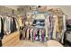 A spacious walk-in closet with custom shelving, hanging rods, and drawers at 5667 Sw 92Nd Pl, Ocala, FL 34476