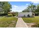 Manicured backyard featuring a gazebo and white picket fence at 6157 Ne 25Th Ave, Ocala, FL 34479