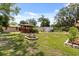 Manicured backyard featuring a gazebo and shed at 6157 Ne 25Th Ave, Ocala, FL 34479