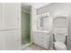 Bathroom with a stand-up shower, white vanity, and mirrored medicine cabinet at 6157 Ne 25Th Ave, Ocala, FL 34479