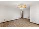 Bright bedroom with wood-look floors, ceiling fan, and fresh paint at 6157 Ne 25Th Ave, Ocala, FL 34479