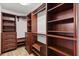 A walk-in closet with built-in shelving, drawers, and hanging rods maximizes storage space at 6157 Ne 25Th Ave, Ocala, FL 34479