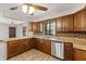 Kitchen showcases wood cabinets, stainless steel appliances, and a garden window at 6157 Ne 25Th Ave, Ocala, FL 34479