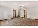 This bedroom features wood-look tile flooring and access to the closet and main bath at 6157 Ne 25Th Ave, Ocala, FL 34479