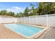 Backyard pool with a tiled pool deck and privacy fence at 6157 Ne 25Th Ave, Ocala, FL 34479