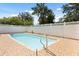 Backyard pool with a tiled pool deck and privacy fence at 6157 Ne 25Th Ave, Ocala, FL 34479