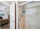 Updated bathroom with tiled shower, grab bars and easy access to the bedroom at 6448 Sw 111Th Pl, Ocala, FL 34476