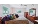 Cozy bedroom with wood-look flooring, ample natural light and traditional furnishings at 6448 Sw 111Th Pl, Ocala, FL 34476