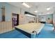 Relaxing game room features pool tables, comfortable seating, and ample space for recreation at 6448 Sw 111Th Pl, Ocala, FL 34476