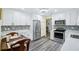 Updated kitchen featuring new white cabinetry, stainless steel appliances, and modern countertops at 6448 Sw 111Th Pl, Ocala, FL 34476