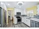 Modern kitchen features white cabinets, stainless steel appliances and stylish backsplash at 6448 Sw 111Th Pl, Ocala, FL 34476
