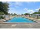 Community pool offers refreshing waters, ample seating, and a serene atmosphere for residents at 6448 Sw 111Th Pl, Ocala, FL 34476