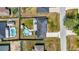 Birds-eye view of a charming home complete with a backyard pool, ample yard space and patio at 7 Larch Dr, Ocala, FL 34480