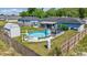 Private fenced backyard with an above-ground pool, shed, patio, and lush landscaping at 7 Larch Dr, Ocala, FL 34480