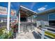 Outdoor bar area with a custom bar, seating, and decorative elements in the backyard at 7 Larch Dr, Ocala, FL 34480