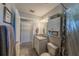 Bathroom featuring gray tiling, a shower-tub combination, white cabinets, offering a functional space at 7 Larch Dr, Ocala, FL 34480
