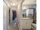 Bright bathroom with granite counters, white cabinetry, and decorative shelving at 7 Larch Dr, Ocala, FL 34480