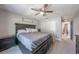 Bedroom featuring a ceiling fan, carpet, and dark furniture at 7 Larch Dr, Ocala, FL 34480