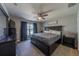 Comfortable bedroom with a ceiling fan, carpet, and dark furniture at 7 Larch Dr, Ocala, FL 34480