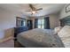 Bedroom featuring dark furniture, a ceiling fan, and window at 7 Larch Dr, Ocala, FL 34480