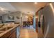 Open-concept kitchen and dining area with granite countertops, and stainless steel appliances at 7 Larch Dr, Ocala, FL 34480