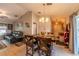 Open-concept dining room and living room with hardwood floors and vaulted ceilings and decor at 7 Larch Dr, Ocala, FL 34480