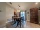 Dining room with a chandelier, wood table, and sliding glass doors to the backyard at 7 Larch Dr, Ocala, FL 34480