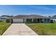Charming home with a well-manicured lawn and a private driveway at 7 Larch Dr, Ocala, FL 34480