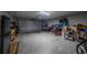 Spacious garage with ample space for storage and parking, with equipment and tools at 7 Larch Dr, Ocala, FL 34480