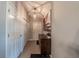 Entryway hallway featuring a wooden cabinet, an art print, and neutral decor at 7 Larch Dr, Ocala, FL 34480