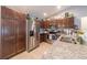 Modern kitchen with stainless steel appliances, granite countertops, and dark wood cabinetry and decor at 7 Larch Dr, Ocala, FL 34480