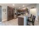 Modern kitchen with stainless steel appliances, granite countertops, and dark wood cabinetry and decor at 7 Larch Dr, Ocala, FL 34480