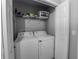 Interior laundry closet featuring a washer, dryer, and overhead shelf at 7 Larch Dr, Ocala, FL 34480