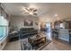Open-concept living space featuring stylish decor, contemporary furniture, and seamless flow into the dining and kitchen areas at 7 Larch Dr, Ocala, FL 34480