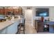 Living room with an eat-in kitchen and a peninsula at 7 Larch Dr, Ocala, FL 34480