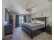 Spacious main bedroom featuring carpet floors, a ceiling fan, and a dark wood furniture set at 7 Larch Dr, Ocala, FL 34480