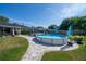 Enjoy a refreshing dip in the above-ground pool with a paver surround and ample patio space at 7 Larch Dr, Ocala, FL 34480