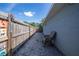 Narrow side yard featuring pea gravel, a fence, and chair storage at 7 Larch Dr, Ocala, FL 34480