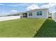 Lush backyard with a privacy fence and green grass, providing ample space for Gathering gatherings and outdoor activities at 7206 Sw 60Th Ln, Ocala, FL 34474