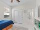 Bright bedroom with closet doors, and natural light and tile flooring at 7206 Sw 60Th Ln, Ocala, FL 34474